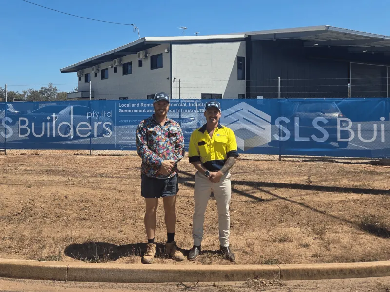 Image of SLS staff in front of building site